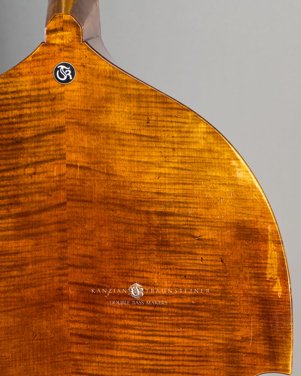 back wood close up and logo insert of Kanzian & Traunsteiner 2026 Antique Viennese Model double bass