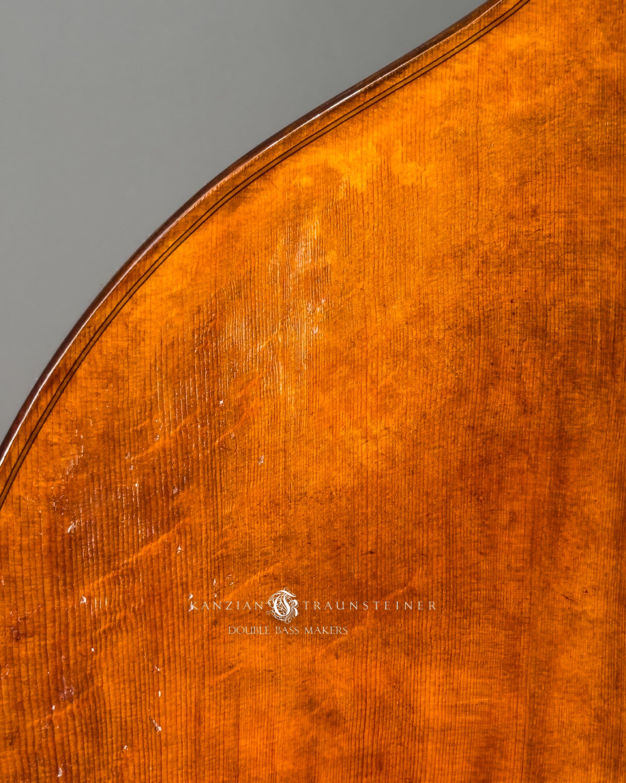 Front wood detail of Kanzian & Traunsteiner double bass with antique finish made in 2026