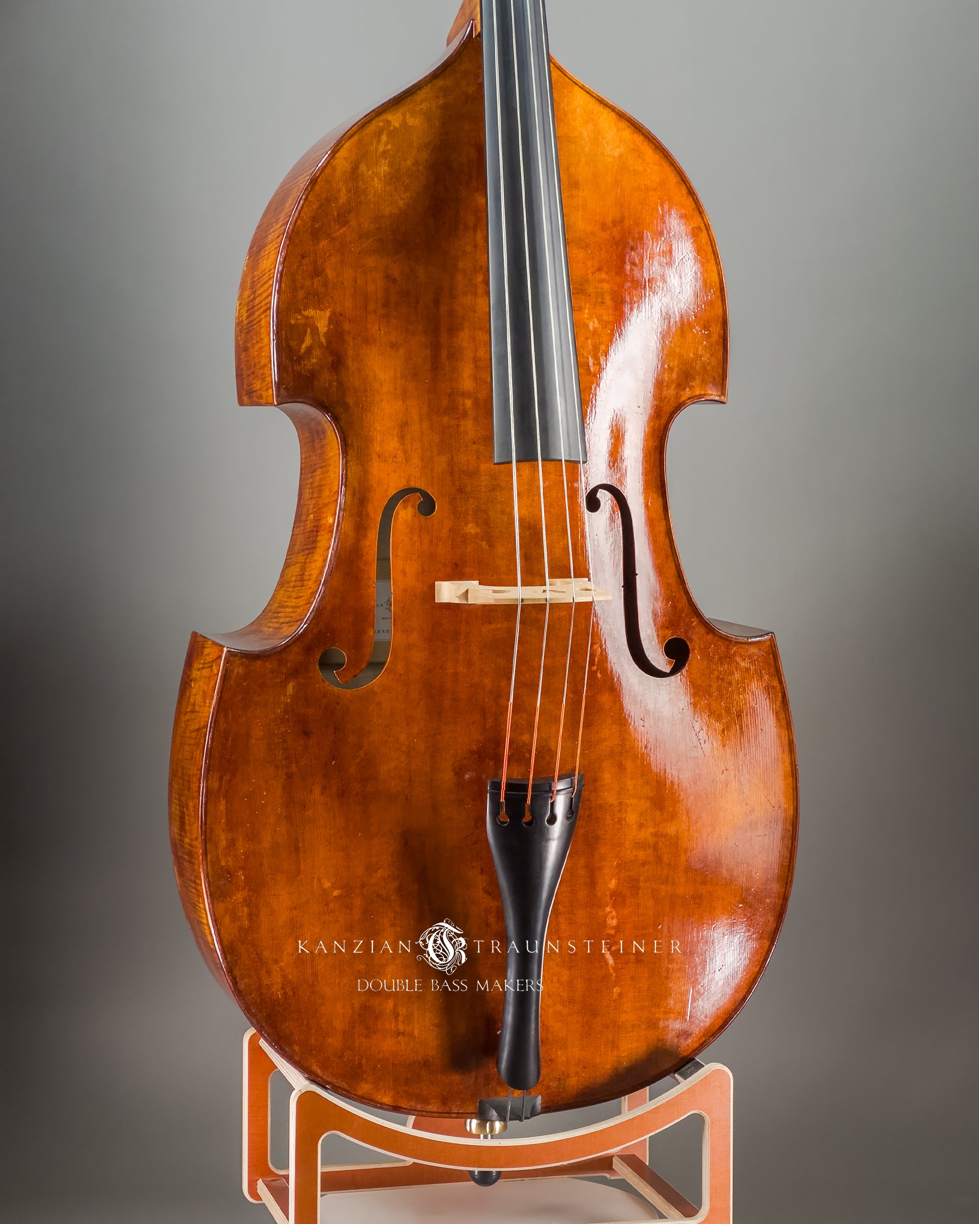 Frontal oblique view of Kanzian & Traunsteiner double bass with antique finish made in 2026