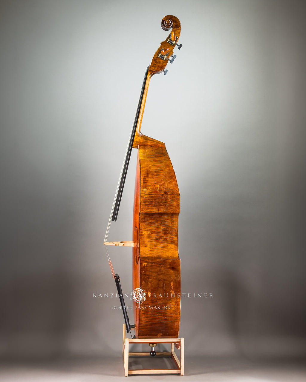 Left side full view of Kanzian & Traunsteiner double bass with antique finish made in 2026