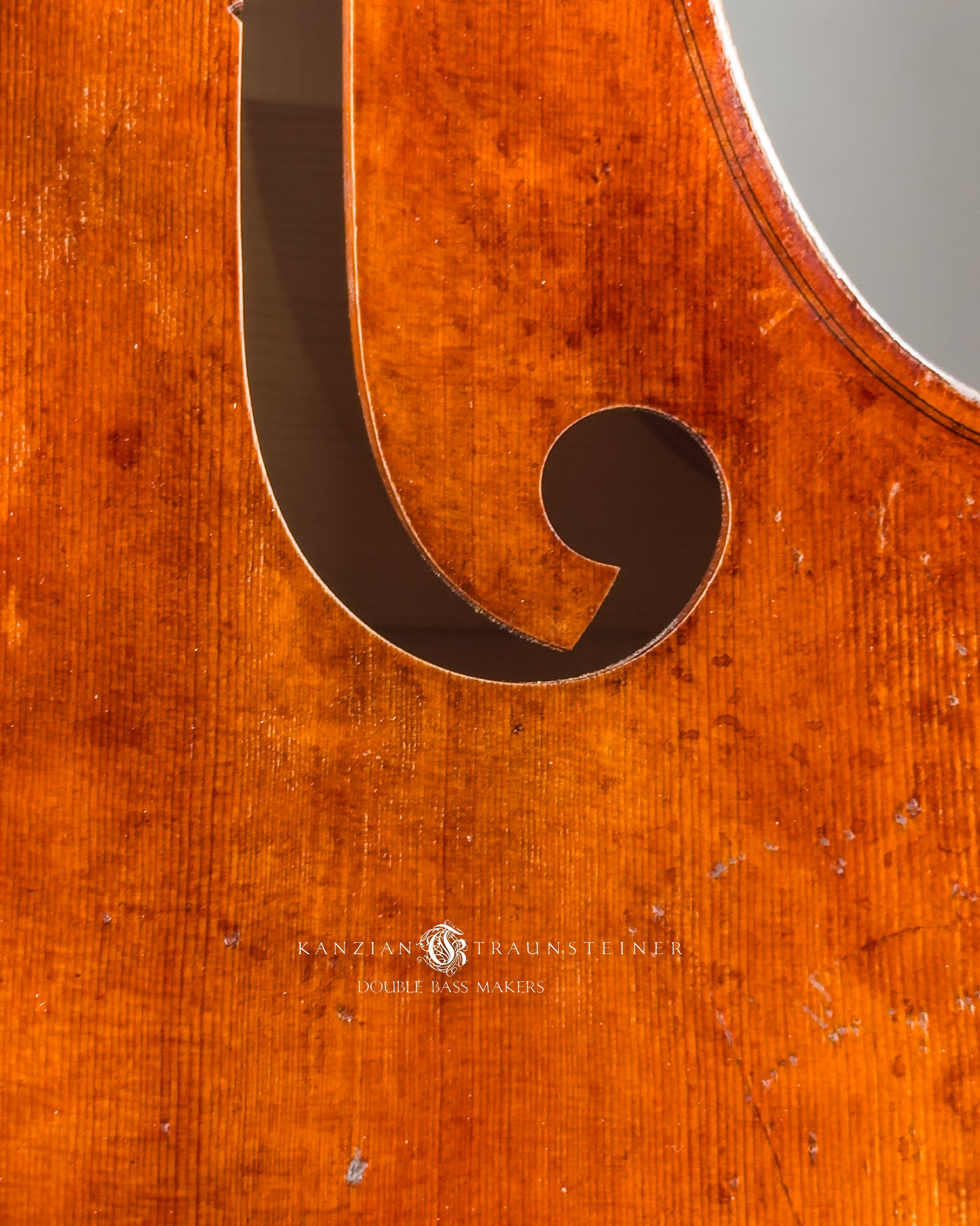 Soundhole detail close up of Kanzian & Traunsteiner double bass with antique finish made in 2026