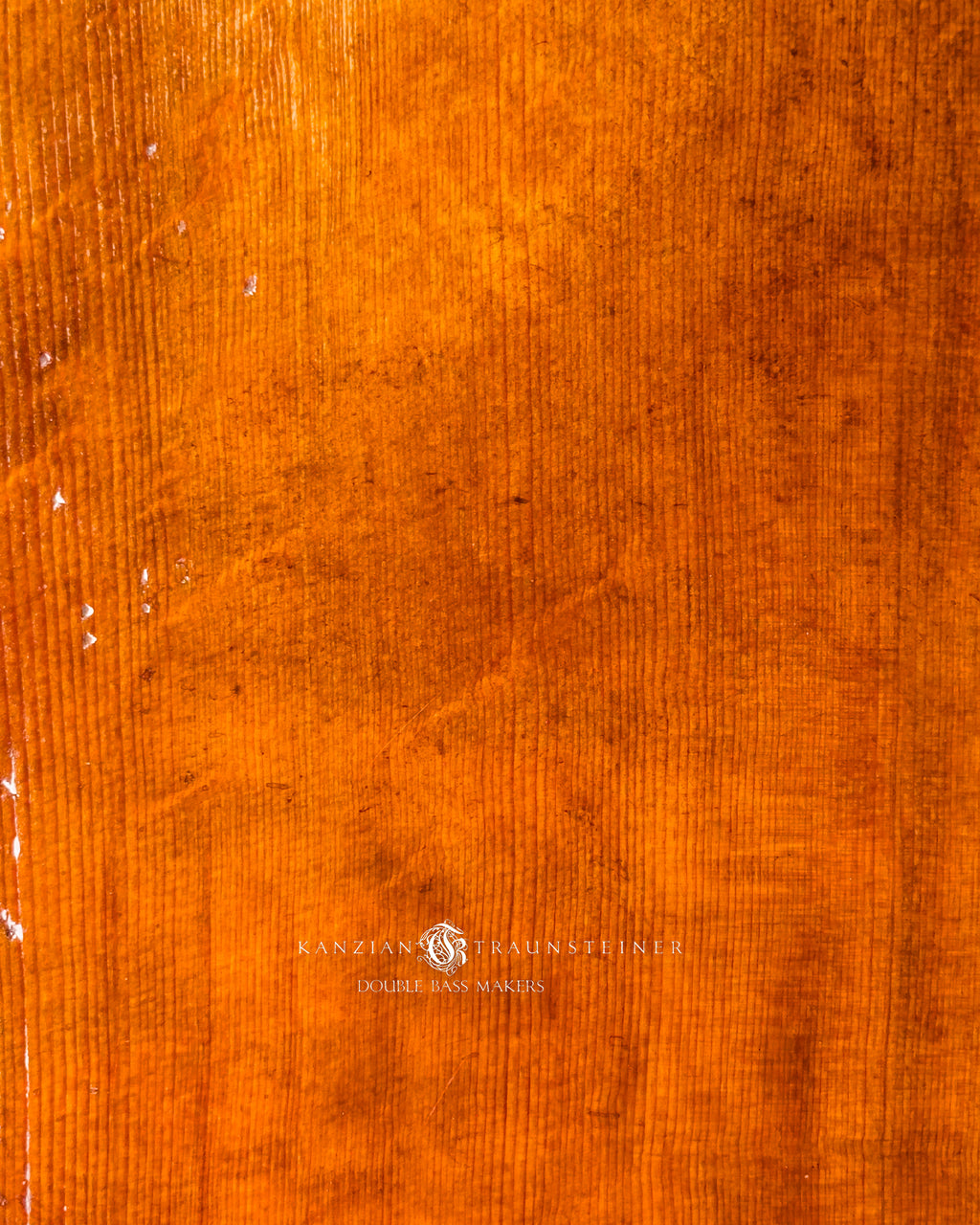 Wood and varnish close up of Kanzian & Traunsteiner double bass with antique finish made in 2026
