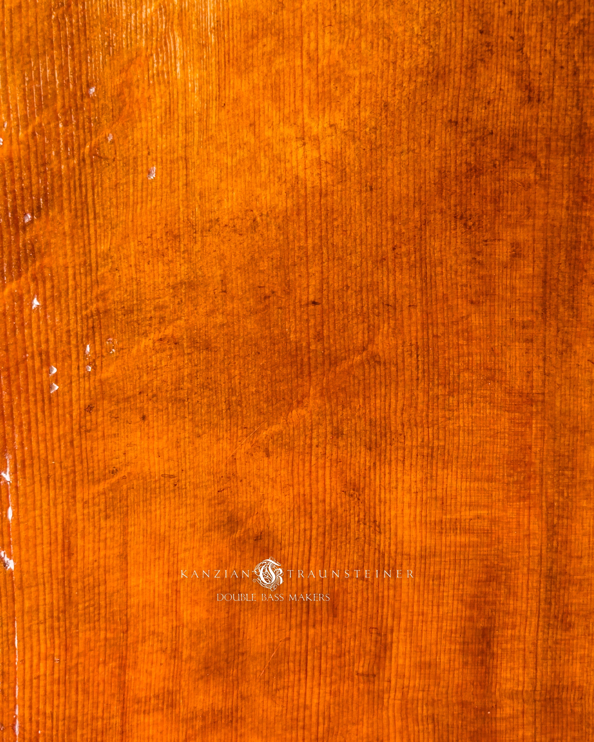 Wood and varnish close up of Kanzian & Traunsteiner double bass with antique finish made in 2026