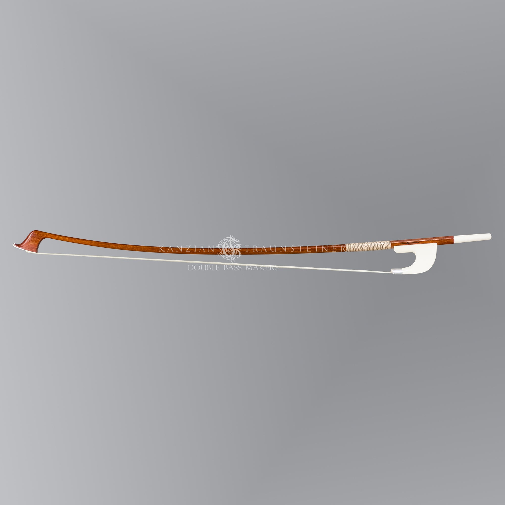 Full view of Kanzian & Traunsteiner bow, 3 stars with white frog and round stick.